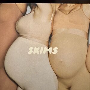 SKIMS Seamless Sculpt Maternity Mid Thigh Shorts in Sand